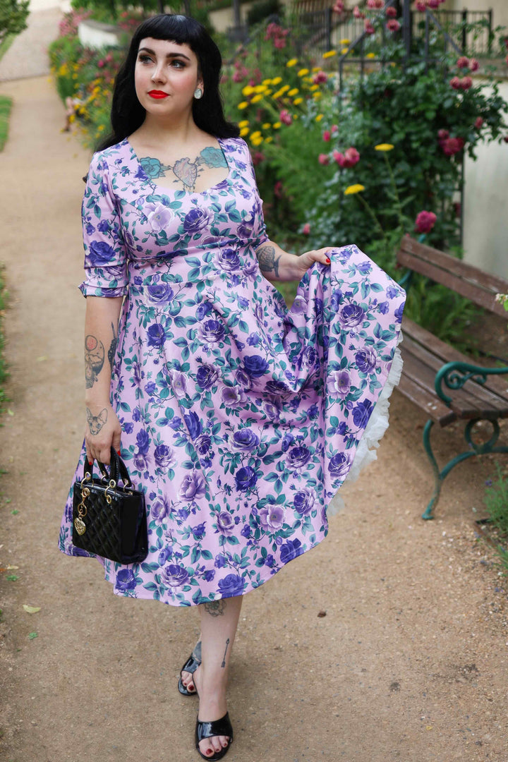 A charming model in a Scarlette Purple Roses on Lilac Dress