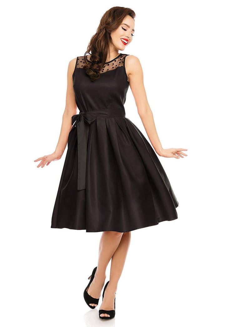 A lovely lady wearing an Elizabeth Black Occasion Dress with Mesh Neckline in the studio