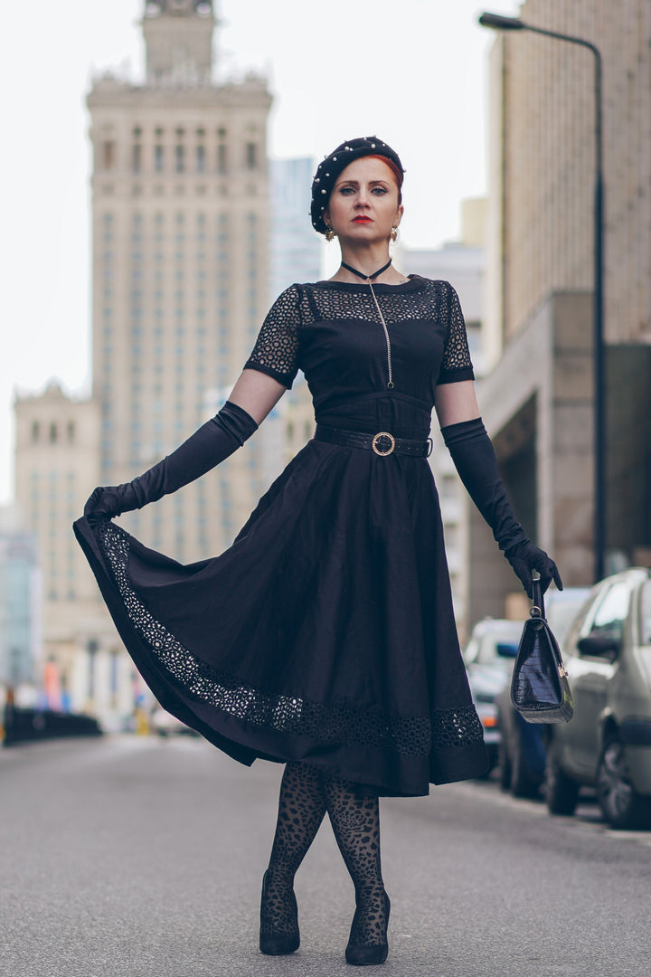 A lovely model wearing a Tess Crochet Lace Formal Dress In Black