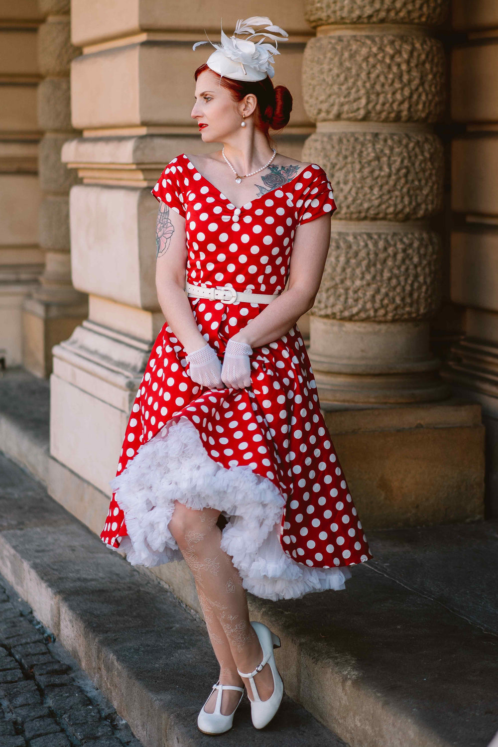 A lovely woman wearing a Lily Red & White Polka Dot Off Shoulder Dress