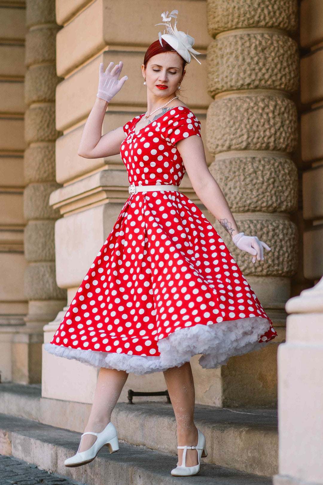A model wearing a Lily Red & White Polka Dot Off Shoulder Dress