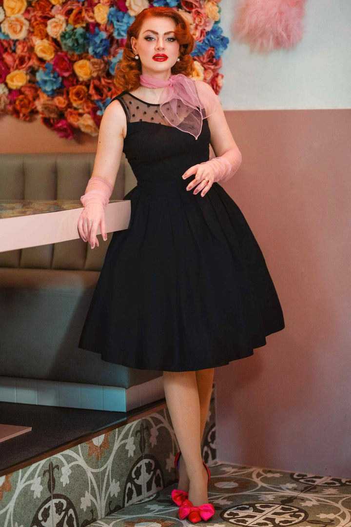 A model wearing an Elizabeth Black Occasion Dress with Mesh Neckline