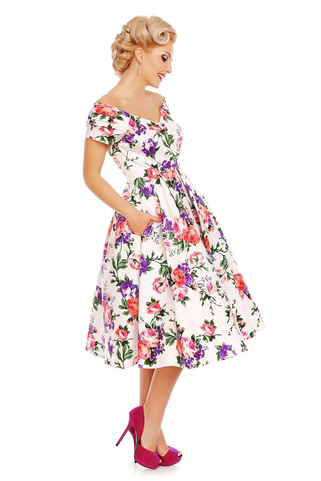 A side angle of lady wearing a Lily White Floral Off Shoulder Dress
