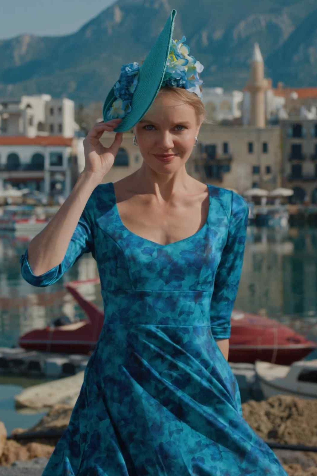 Close up shot of Model posing in Scarlette Blue Watercolour Floral Midi Dress