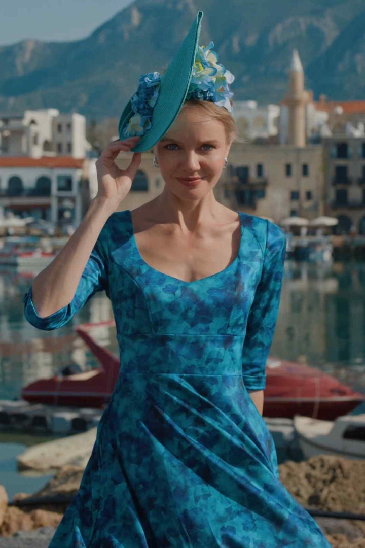 Close up shot of Model posing in Scarlette Blue Watercolour Floral Midi Dress