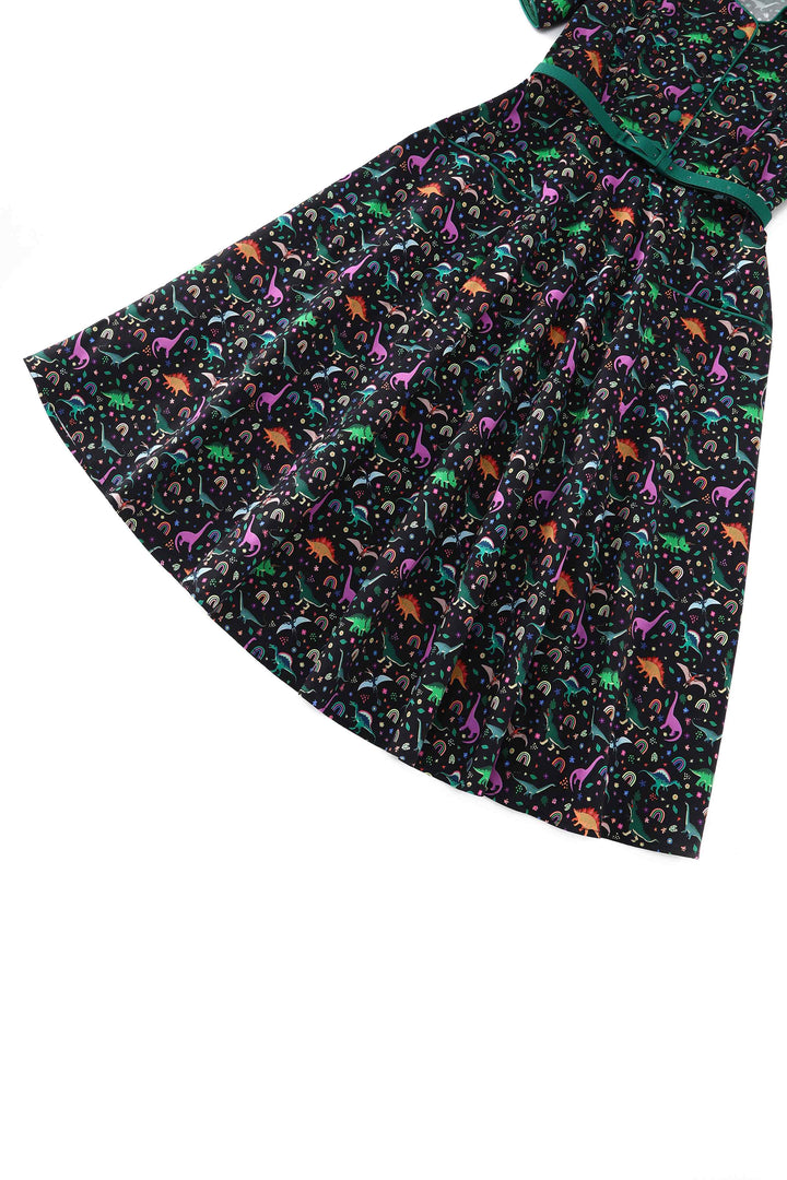 Close up view of Mabel Dinosaur Rainbow Dress | Novelty Print Dress
