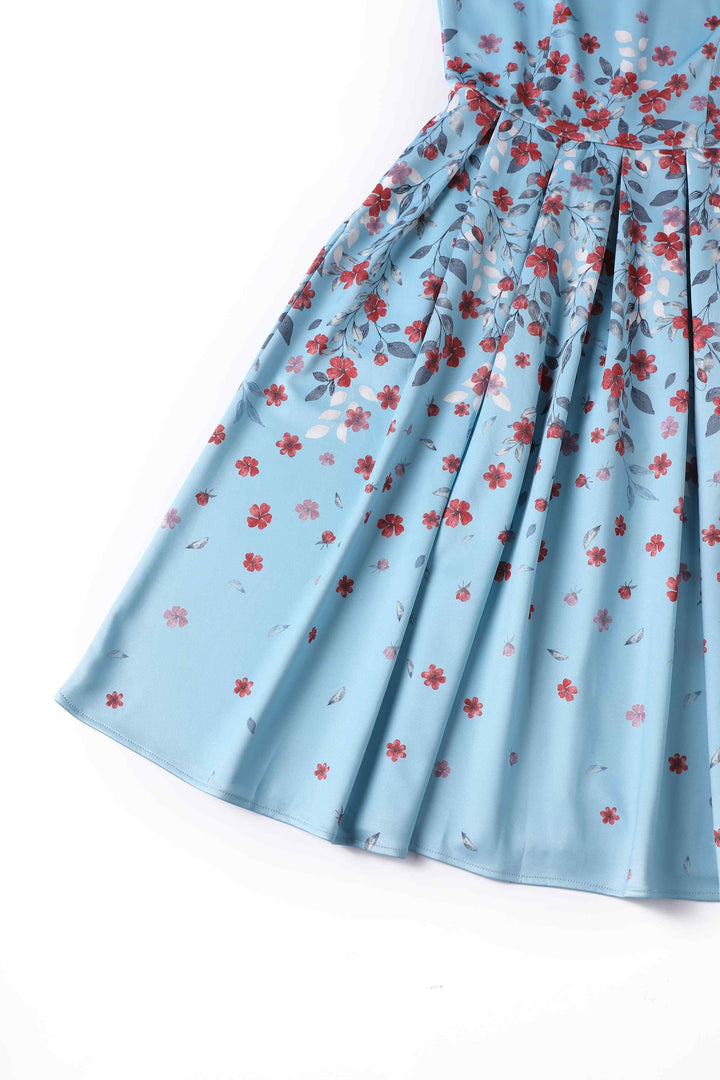 Close up view of the skirt of Amanda Falling Flowers on Light Blue Dress | Vintage Floral Dress