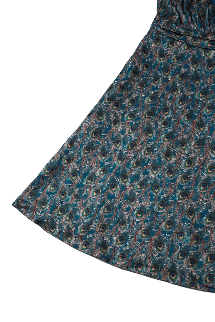 Close up view of the skirt of Donna Peacock Feather Tea Dress
