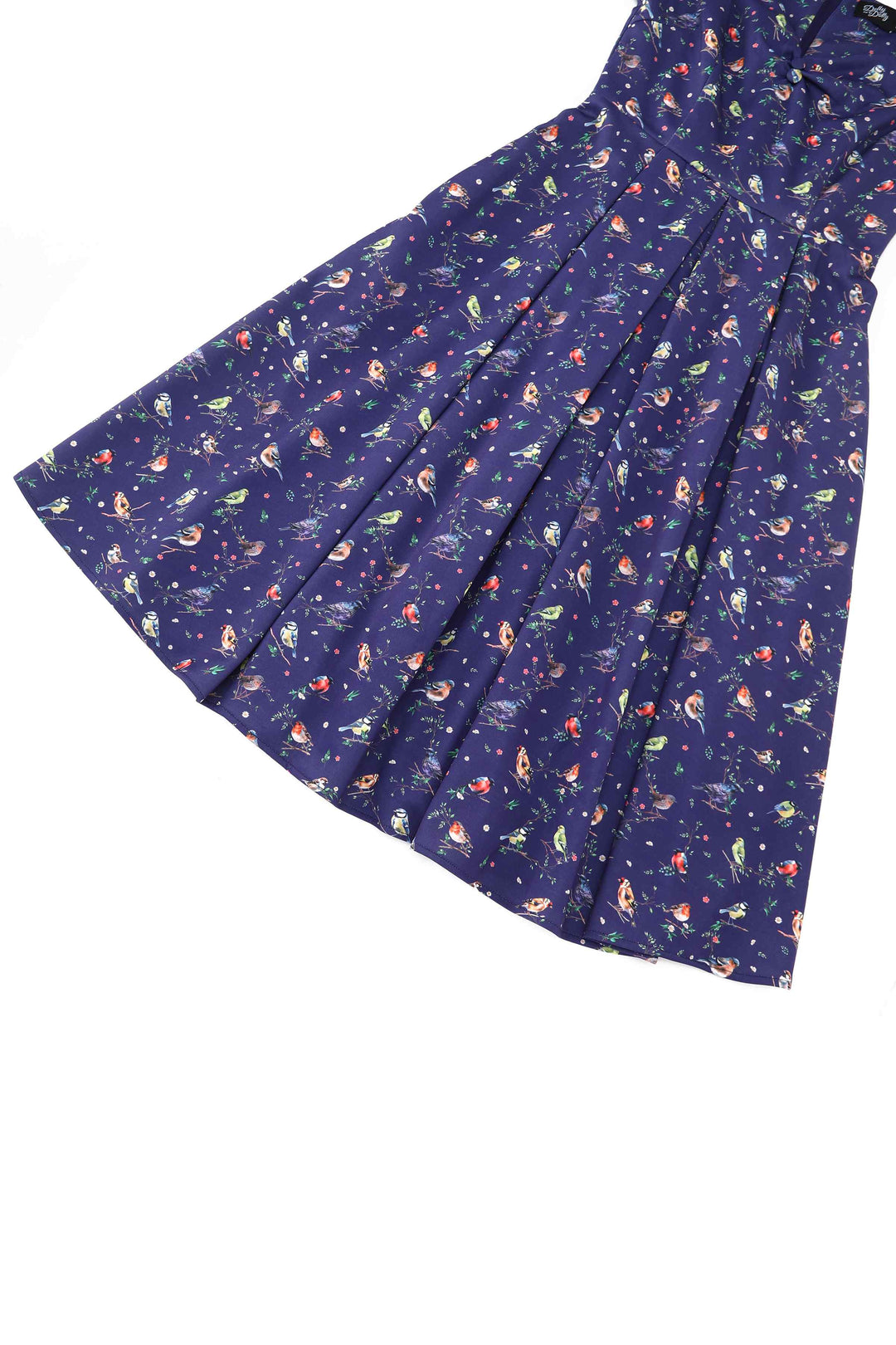 Close up view of Lily Bird Garden on Navy Blue Dress | Whimsical Vintage Dress