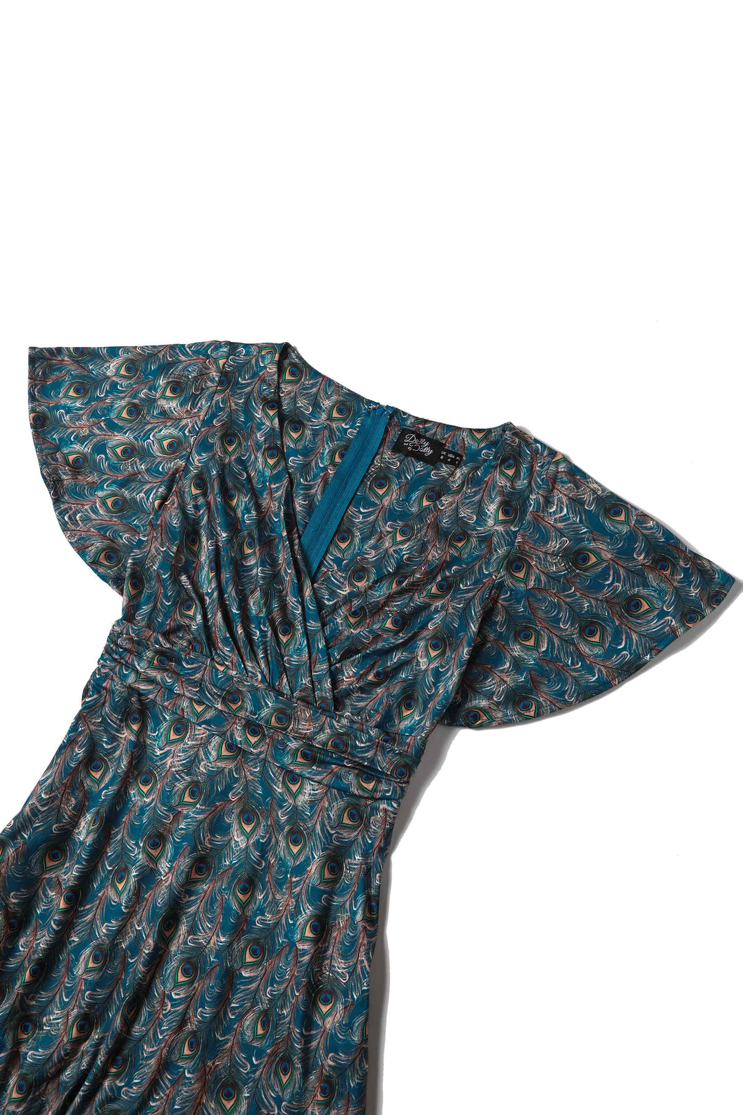Close up view the top of Donna Peacock Feather Tea Dress