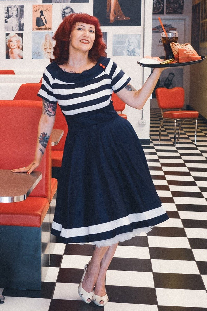 Lady wearing a Darlene Navy White Stripe Dress | Nautical Swing Dress