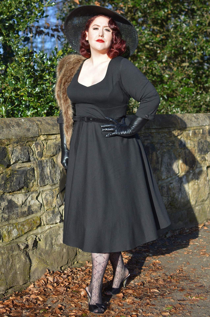 Lady wearing a Scarlette Black Long Sleeve Midi Dress
