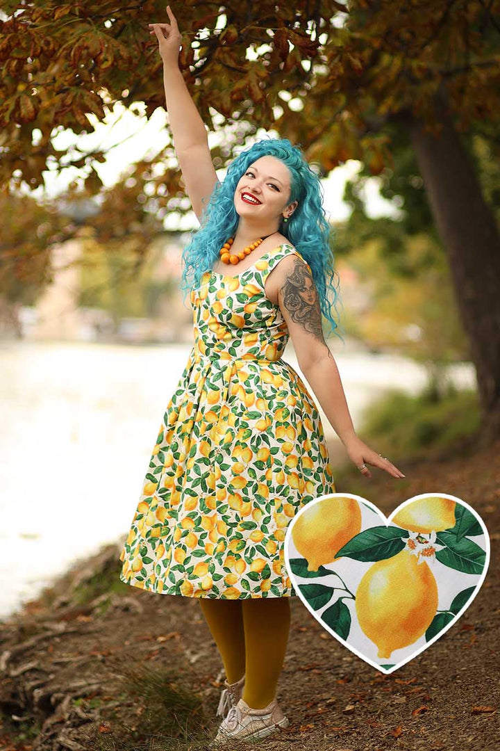 Model in Amanda Juicy Yellow Lemons on White Dress | 50s Style Dress