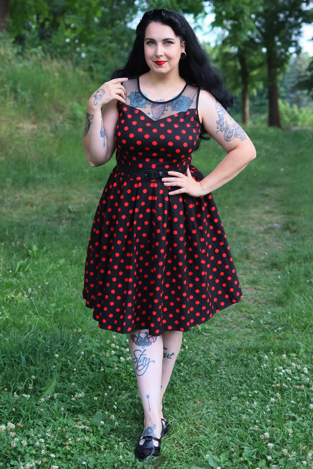 Model in an Elizabeth Black Polka Dot Flared Dress