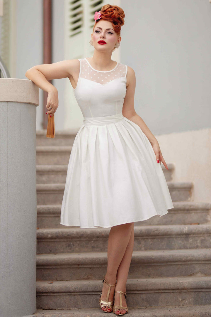Model in an Elizabeth Off White Dress