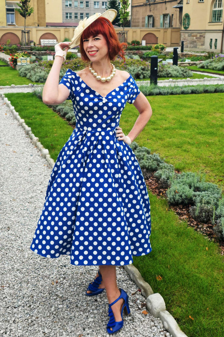Model wearing a Lily Navy Blue & White Polka Dot Dress | 50s Style Dress