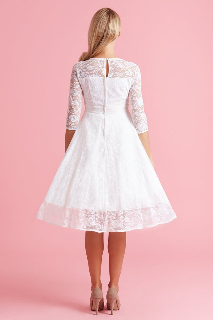 The back of a model wearing a Madeline Ivory White Dress