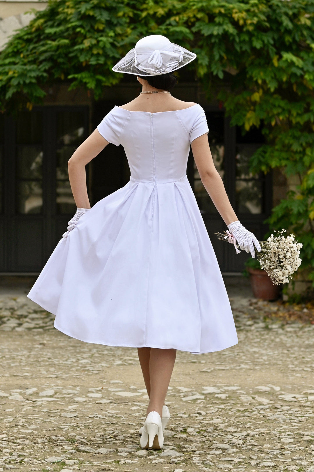 The back of Lovely Model in Lily Off White Dress | 50s Style Dress