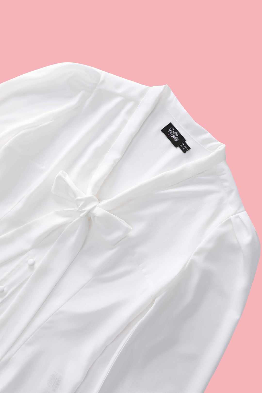 The close up view of the neckline of Margaret Off White Blouse