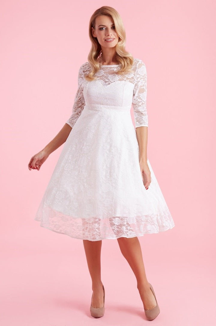 The front of model wearing a Madeline Ivory White Dress