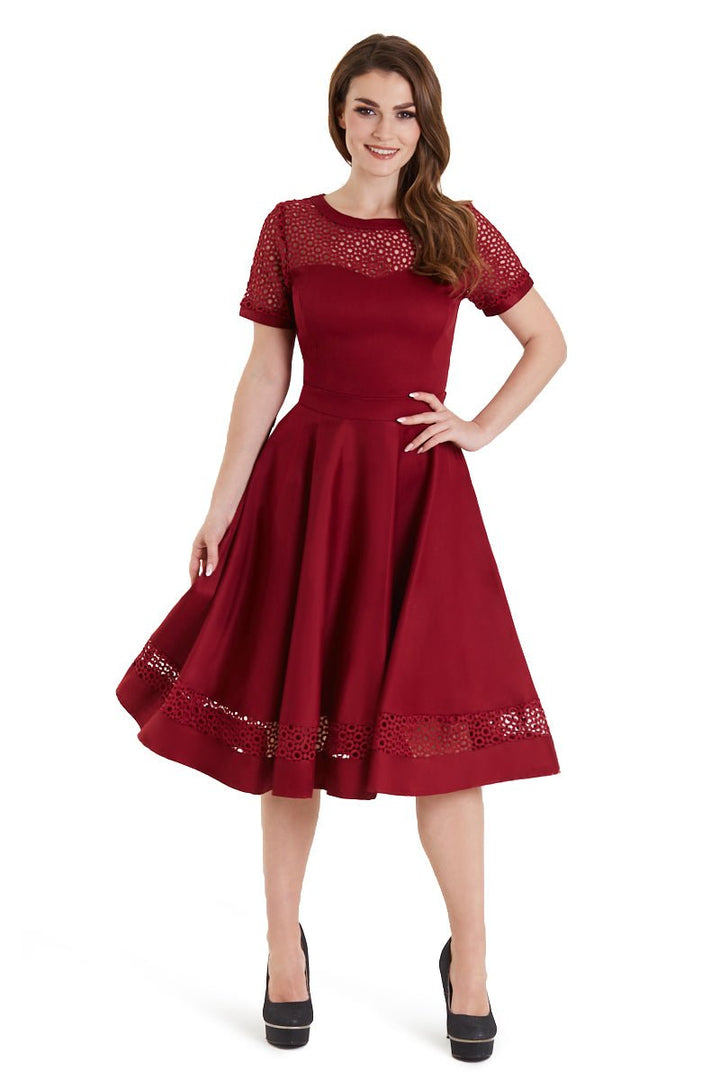 A lady wearing a Tess Crochet Lace Formal Dress In Burgundy