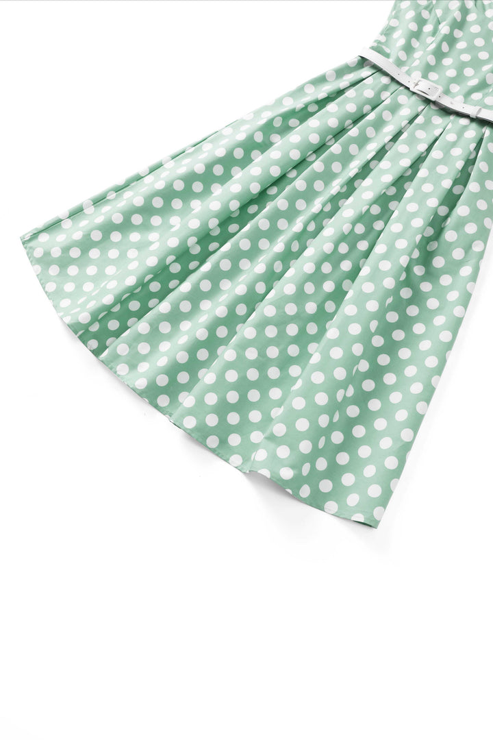 The skirt of the Ophelia Sage Green & White Polka Dot Dress