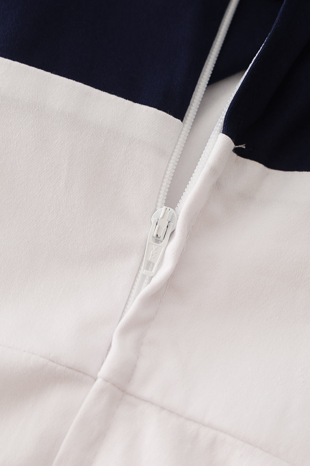 The zip detail of Darlene White Circle Dress with Embroidered Anchors
