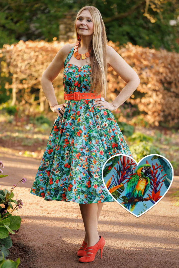 A model in Daisy Tropical Parrot Halterneck Dress