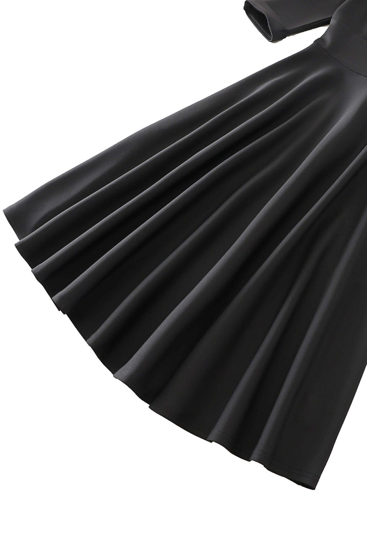 Close up shot the skirt of Scarlette Black Long Sleeve Midi Dress