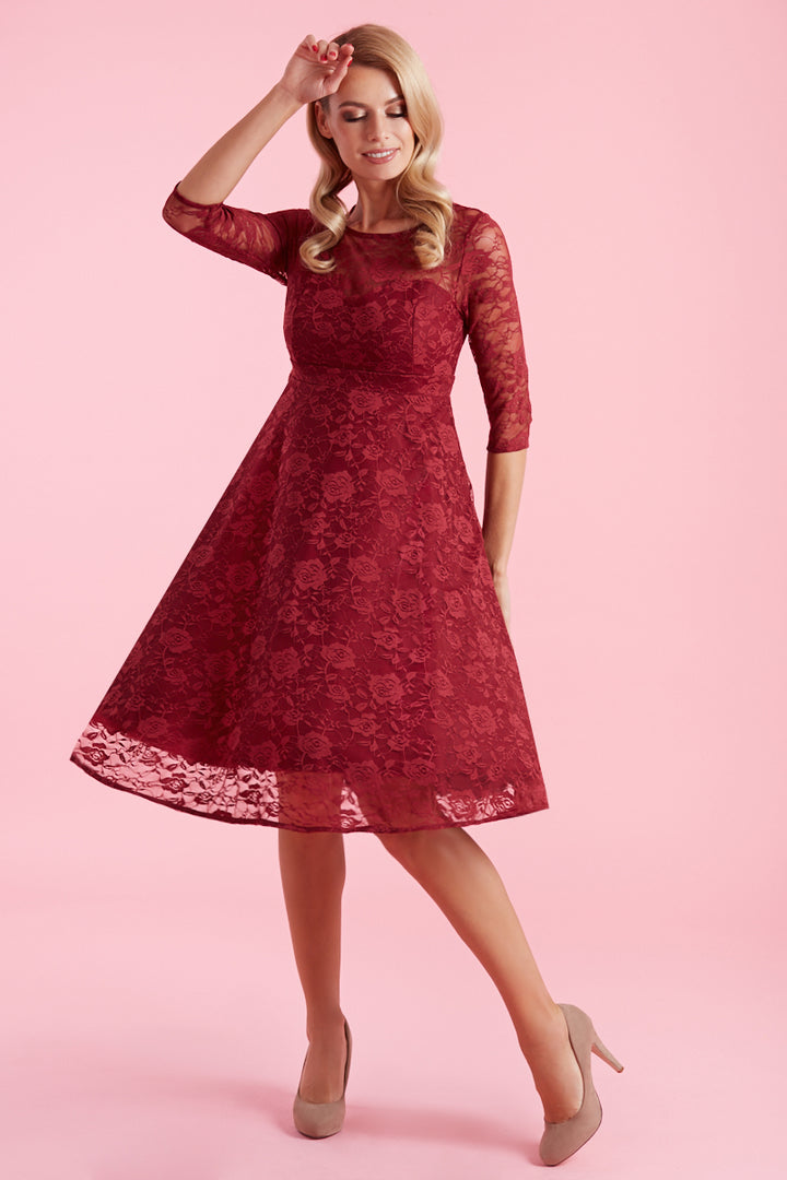 A model in Madeline Long Sleeved Burgundy Lace Dress | Lace Occasion Dress
