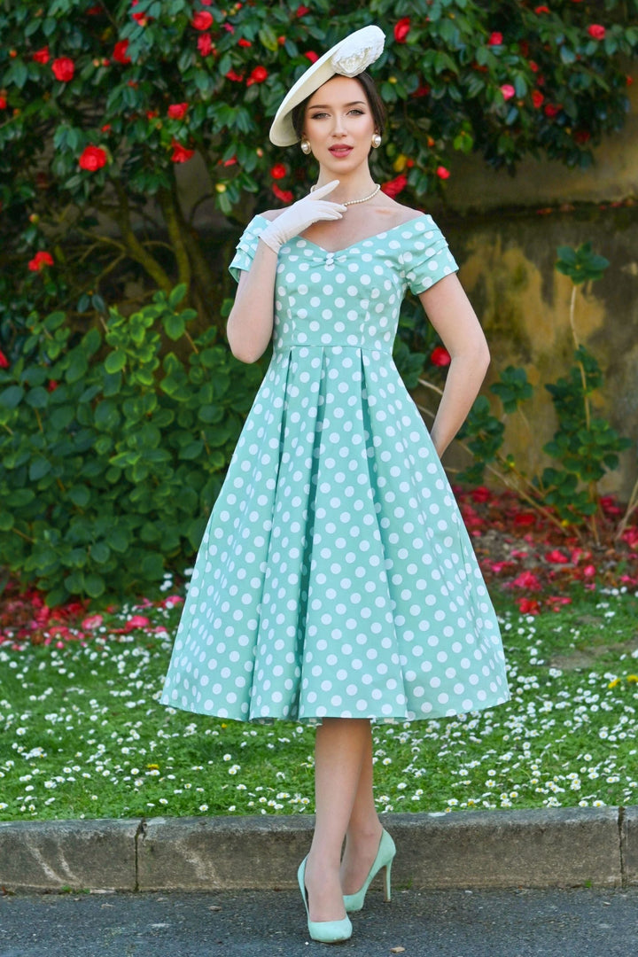 Model in Lily Sage Green & White Polka Dot Dress | 50s Style Dress