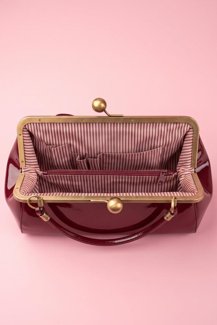 Interior shot of Colette 1950s Kiss-lock Frame Handbag with Bow in Burgundy
