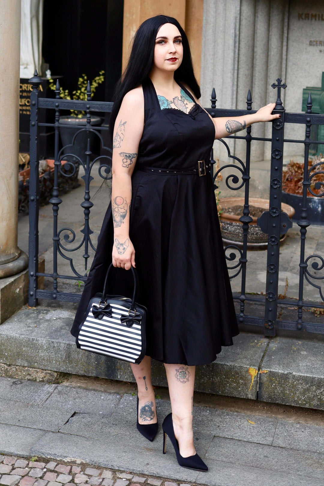 A lovely model in our Daisy Classic Halter Little Black Dress