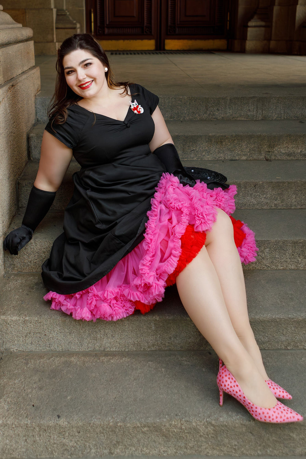 lovely model in a Lily Solid Black Off Shoulder Dress