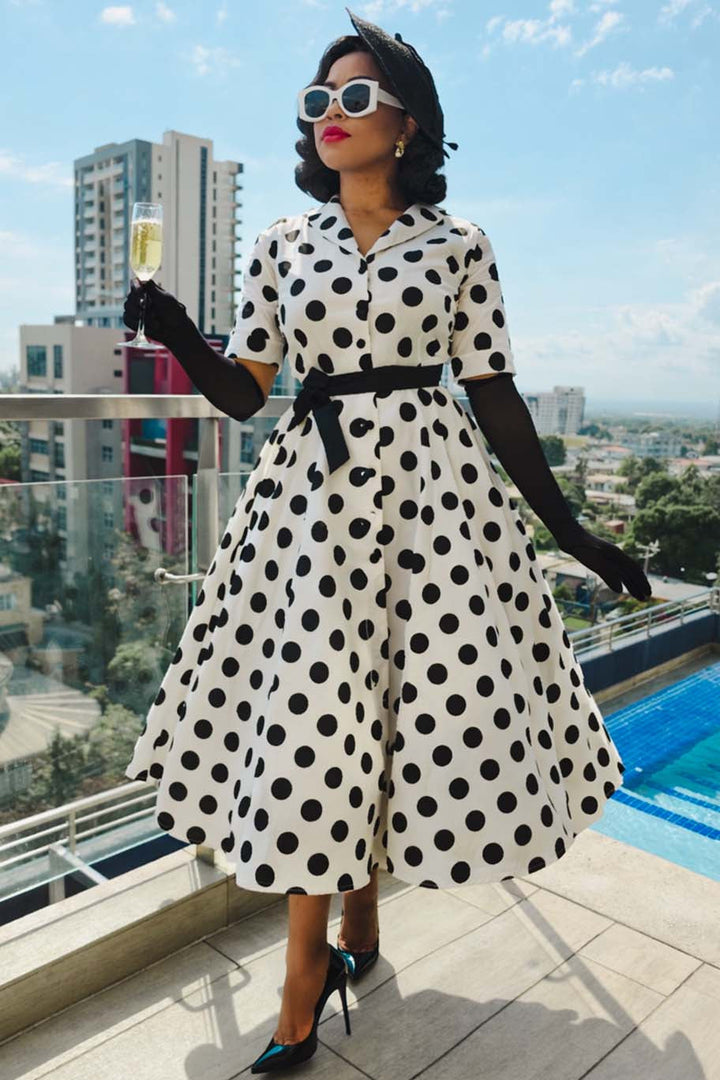 Model in Mollie White & Black Polka Dot Dress | 50s Style Dress