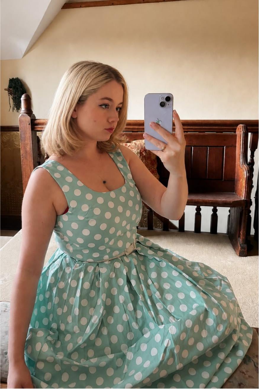 A lovely lady in our Ophelia Sage Polka Dot Midi Dress