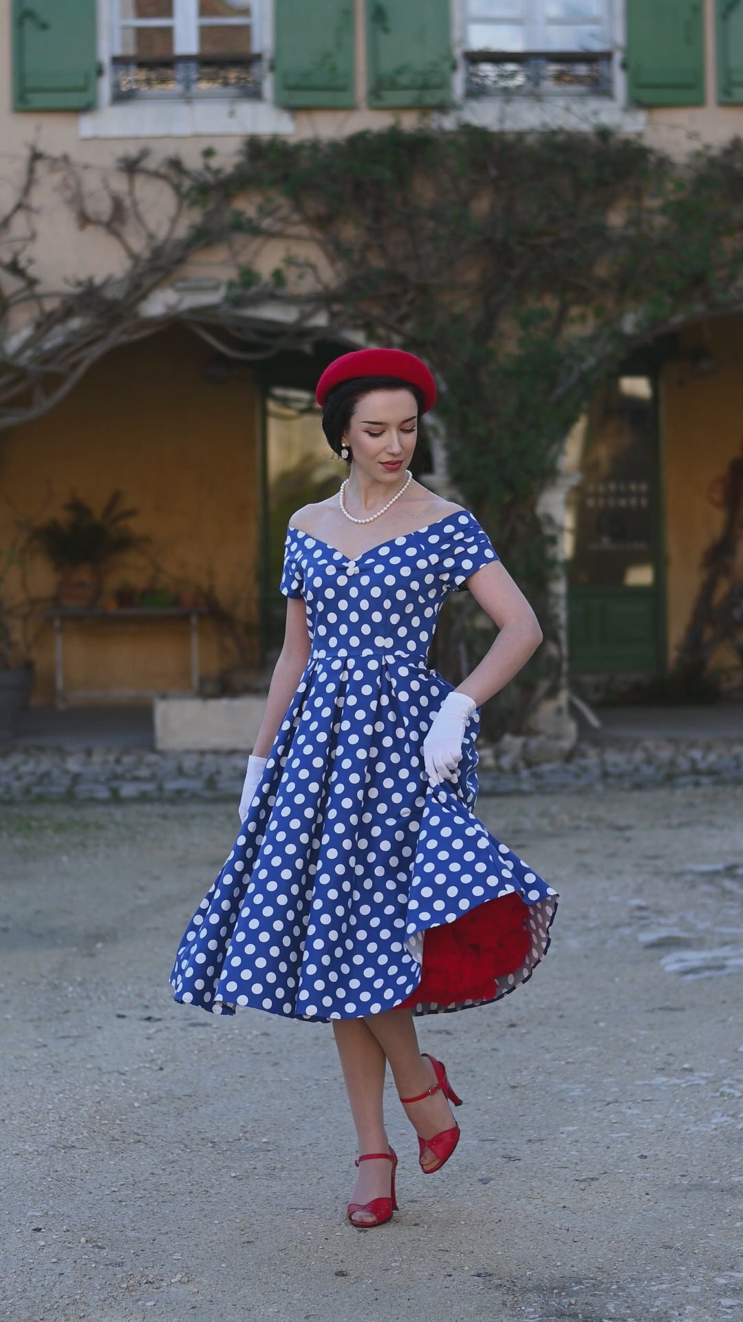 Video of an elegant lady in Lily Navy Blue & White Polka Dot Dress | 50s Style Dress