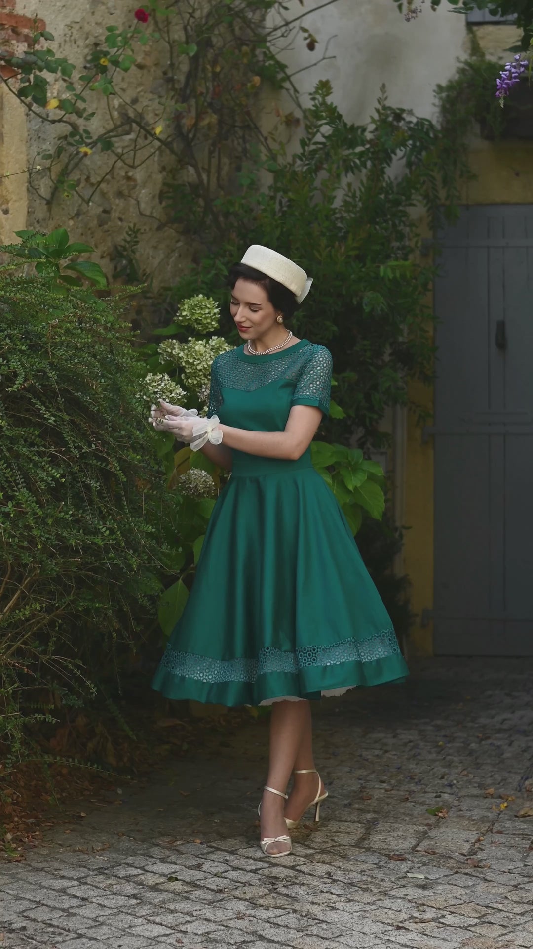 Video of an elegant lady in our Tess Emerald Green Dress | Vintage Occasion Dress
