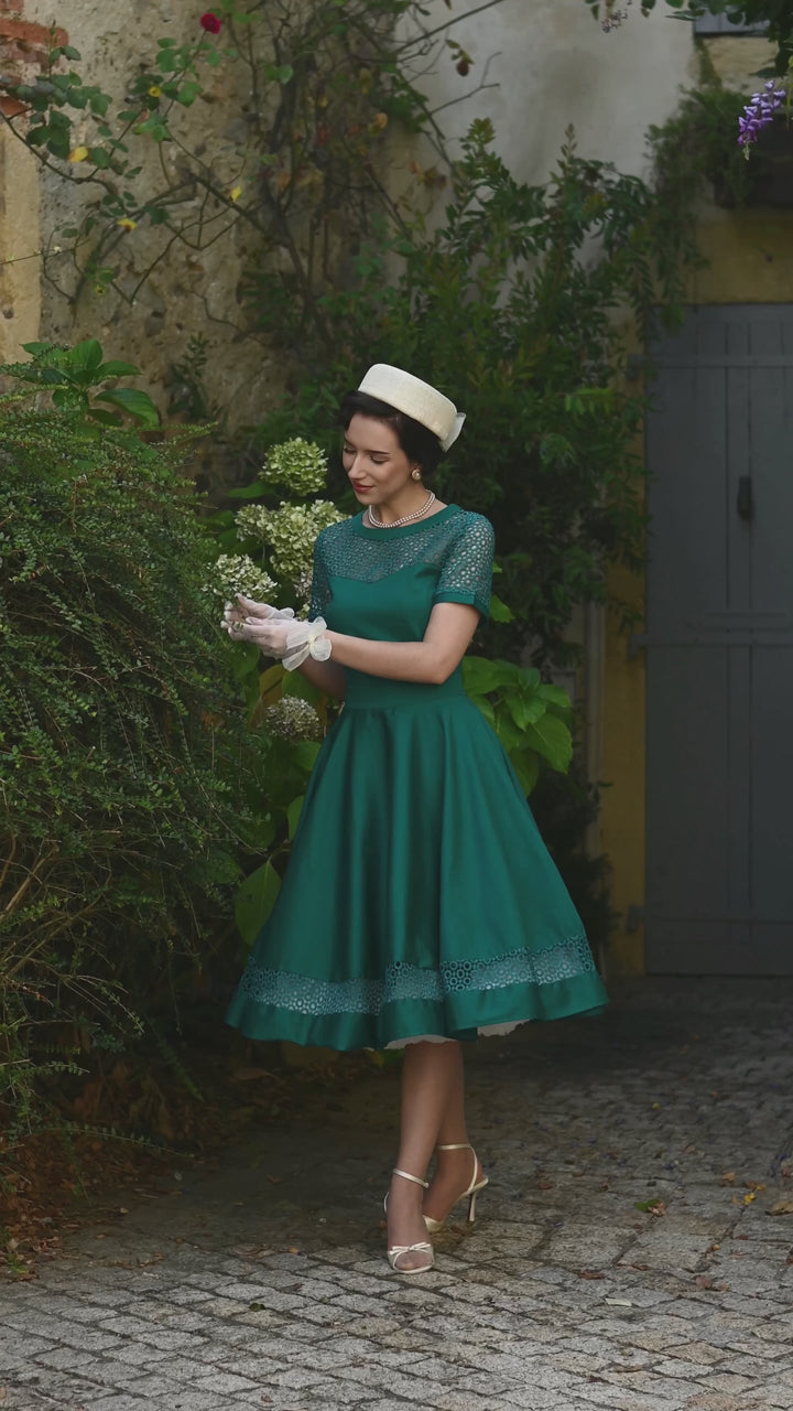 Video of an elegant lady in our Tess Emerald Green Dress | Vintage Occasion Dress