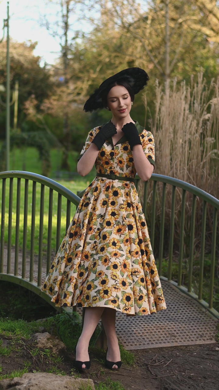 Video of a beautiful lady in Mollie Sunflowers on Cream White Dress | Vintage Floral Dress