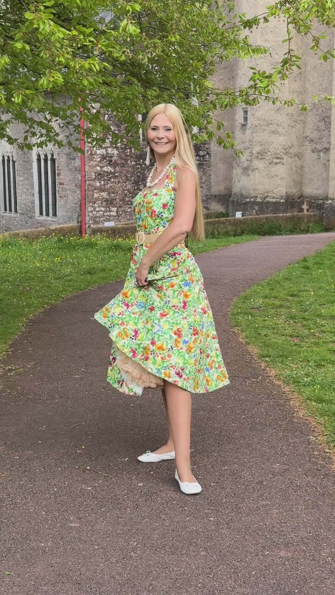 Video of an elegant lady in Daisy Mediterranean Fruit Halter Dress | Vintage Halter Dress