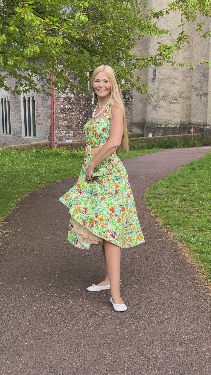 Video of an elegant lady in Daisy Mediterranean Fruit Halter Dress | Vintage Halter Dress