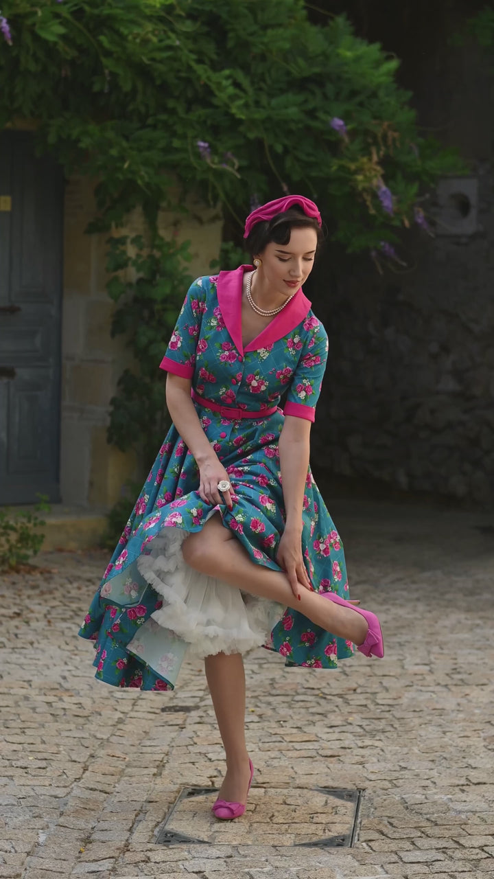 Video of A beautiful lady in our Mollie Vintage Pink Roses on Blue Dress | Vintage Floral Dress