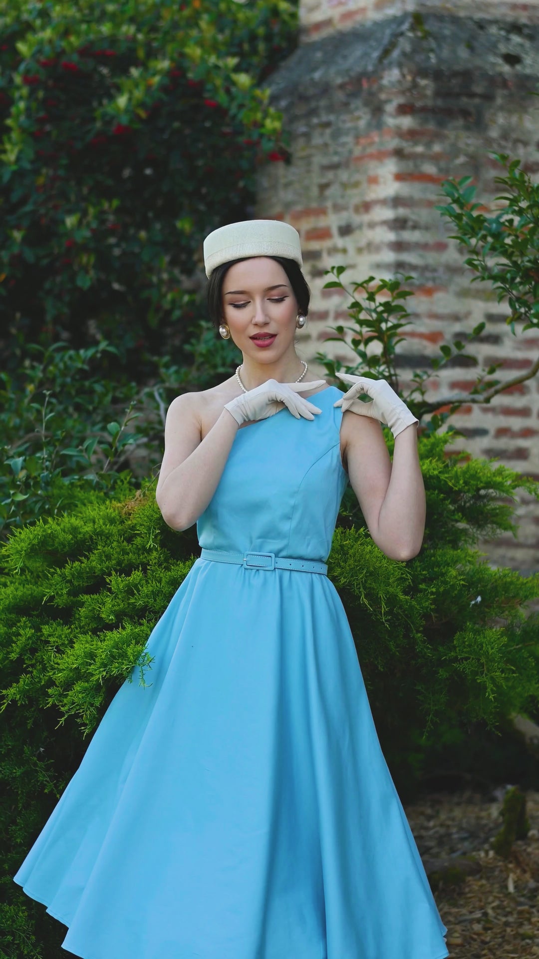 An elegant model in our Susan Baby Blue Dress | Vintage Party Dress